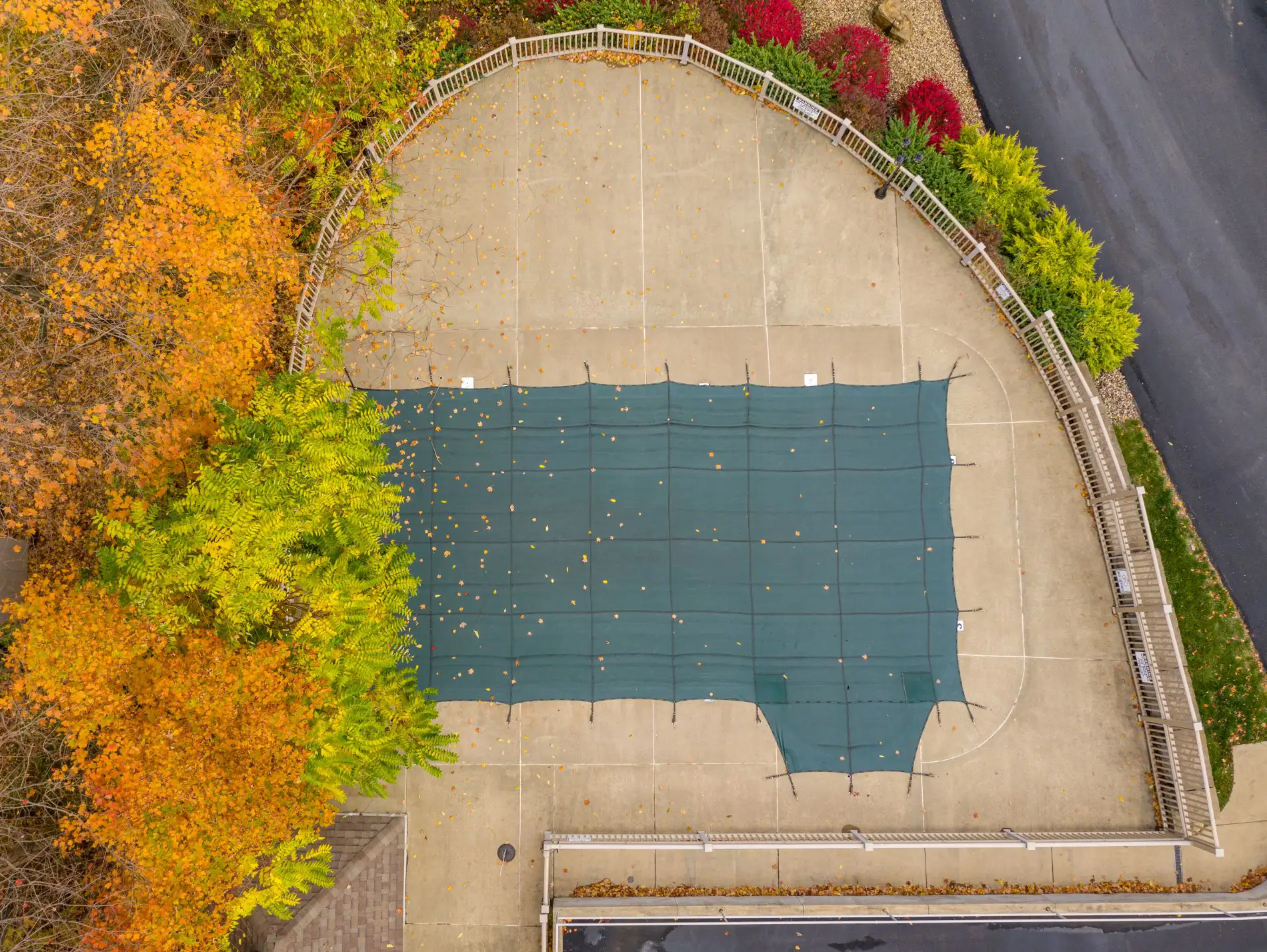 Pool cover fitted over a residential swimming pool